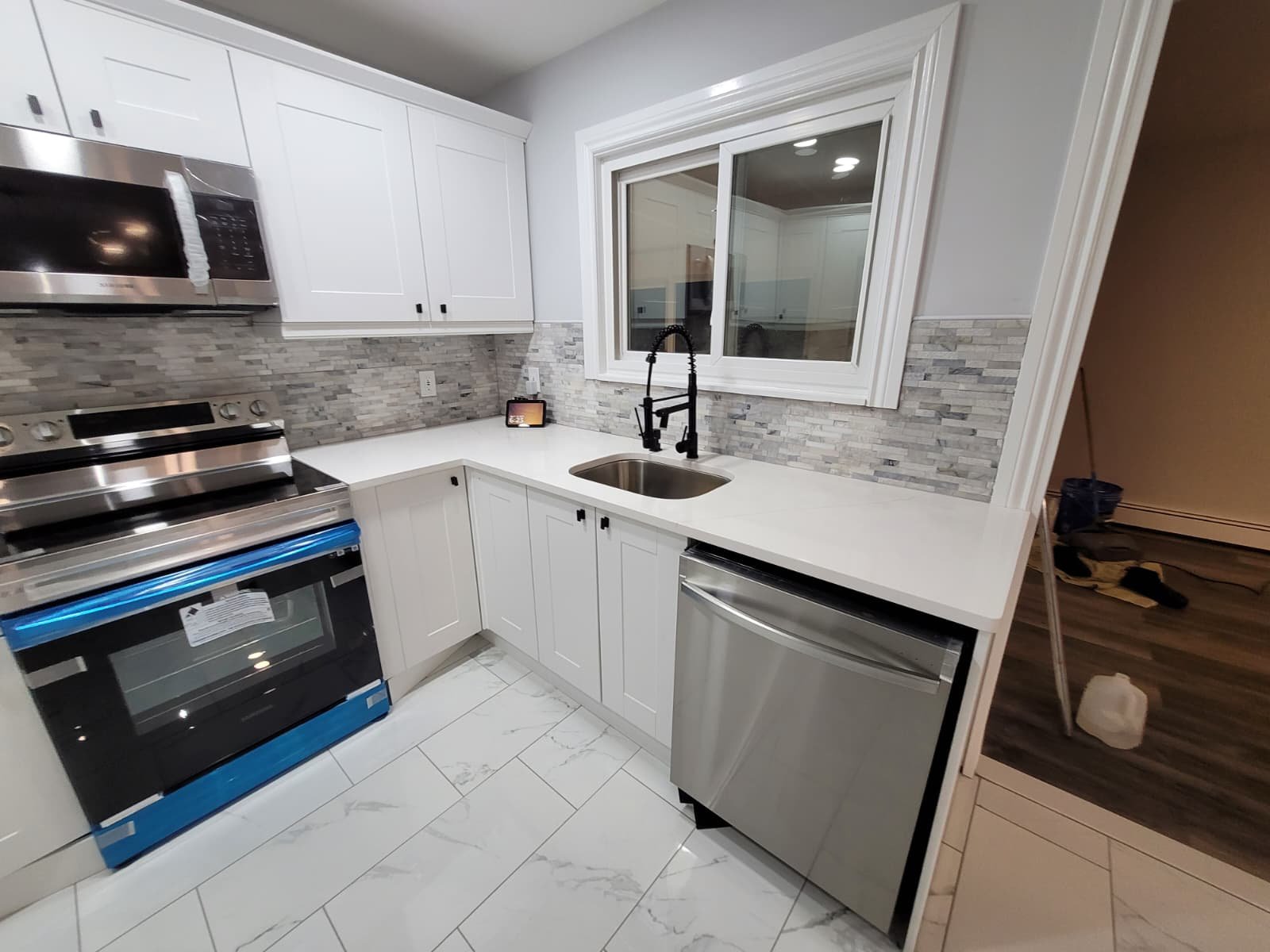 Kitchen upgrades with quartz countertops and stainless-steel appliances